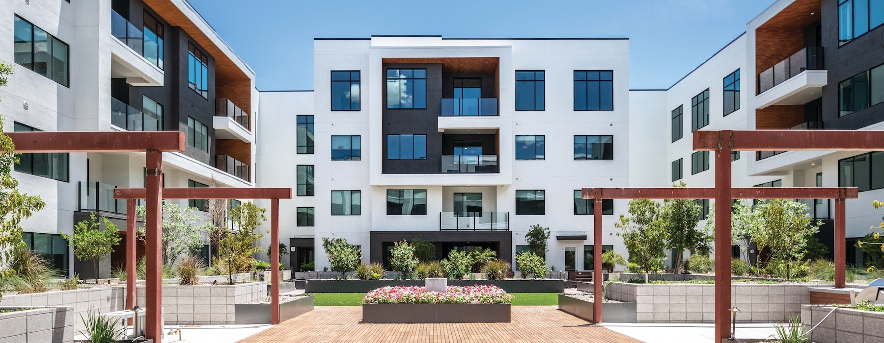 a courtyard with a building in the background