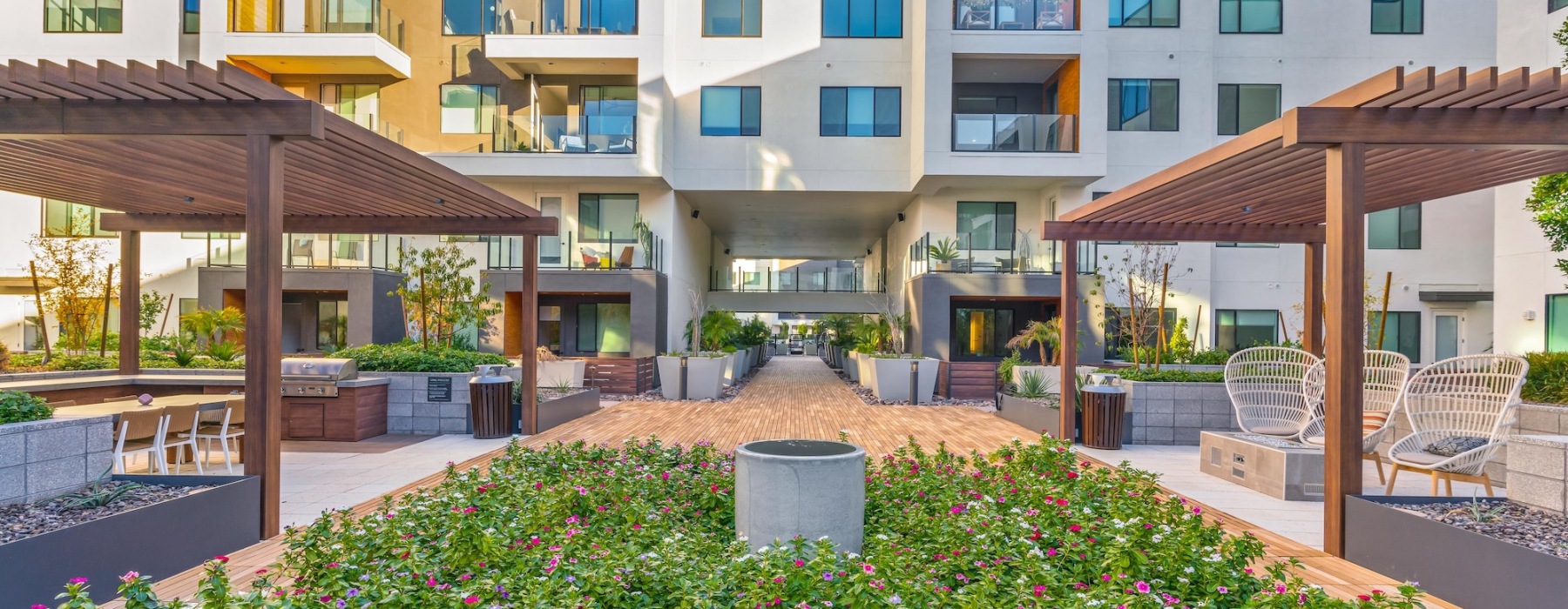 a courtyard with a building in the background