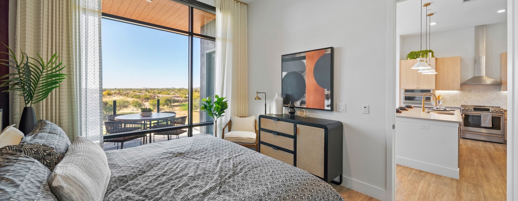 a bedroom with a large window