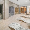 a spa room with wood floors and chairs