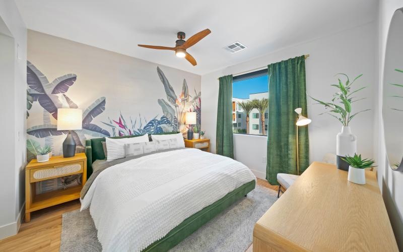 a bedroom with a bed and a desk